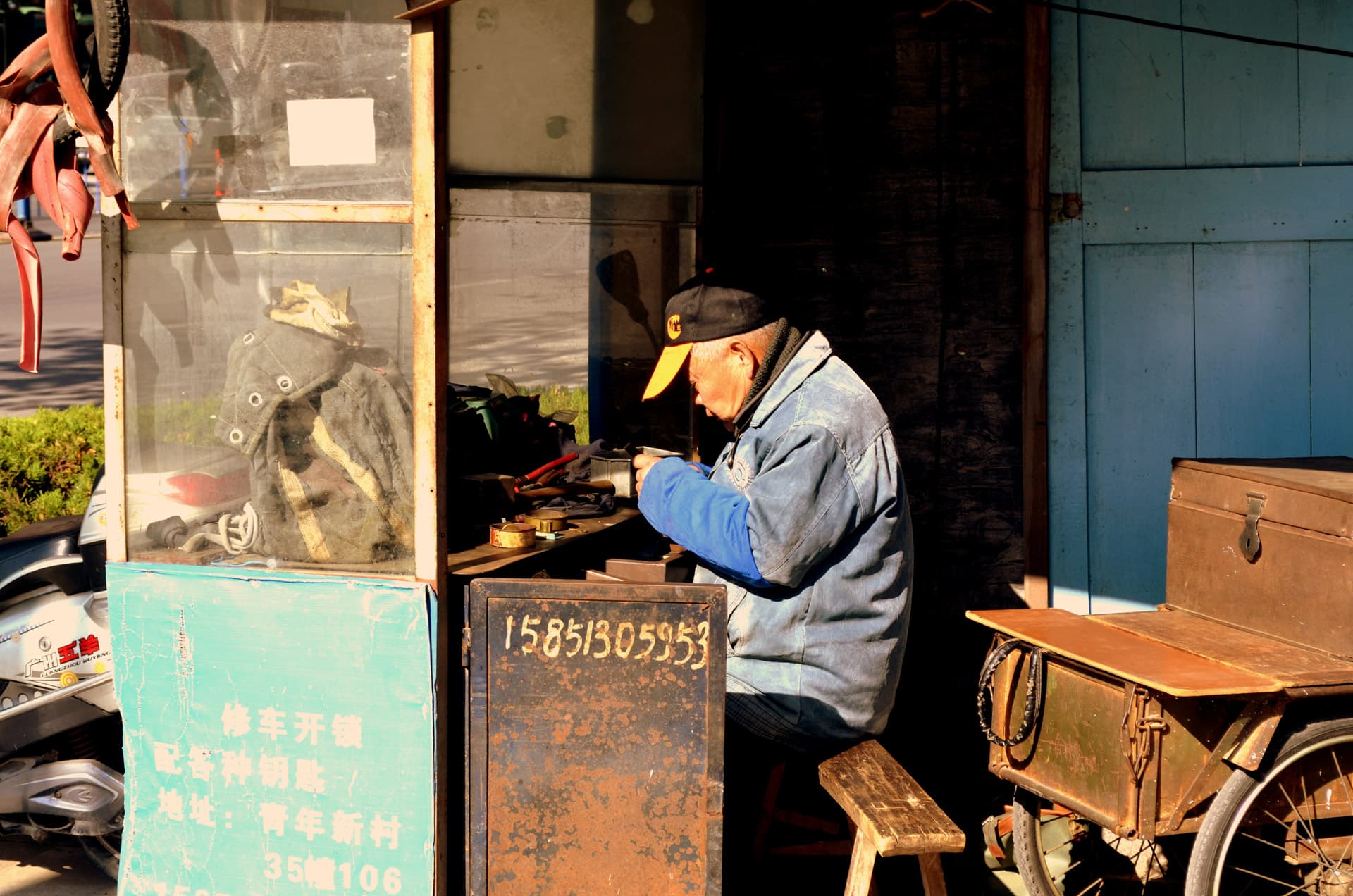 A handyman working at a repair bench